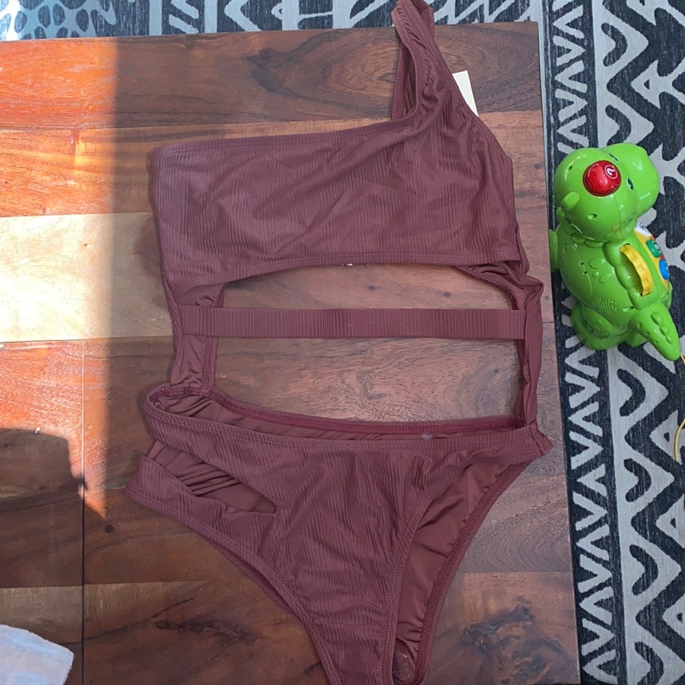 Ribbed maroon one piece with slits and cutouts